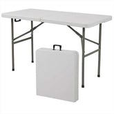 A compact folding table with a sleek white case, positioned against a plain background.